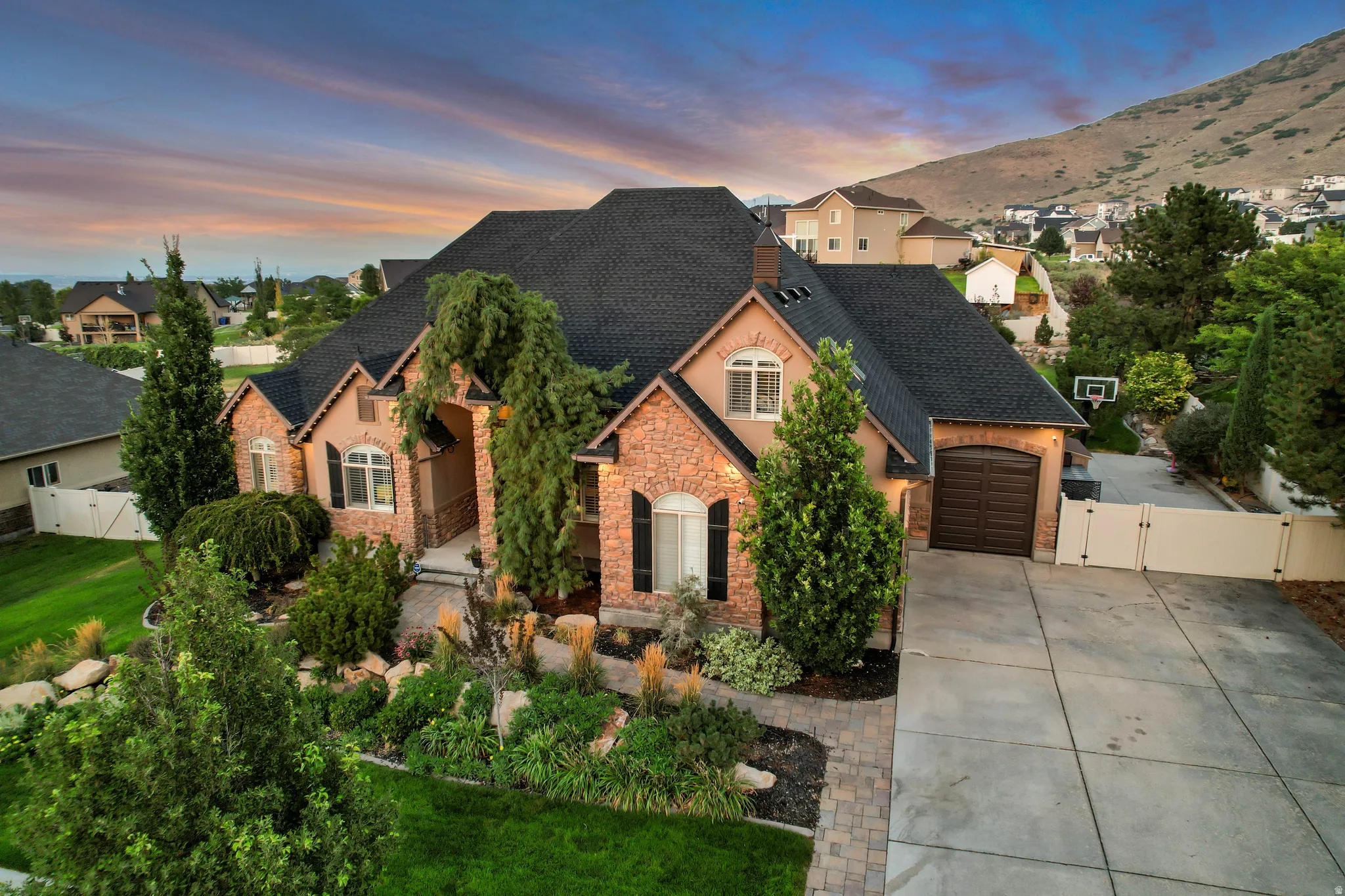 Stone and stucco exterior with multiple gables