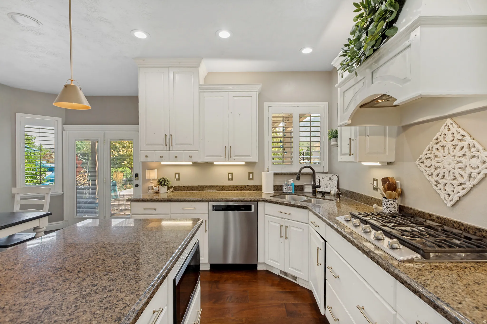 White cabinetry paired with granite countertops