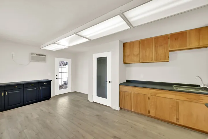 Wood-finish flooring with overhead fluorescent lighting