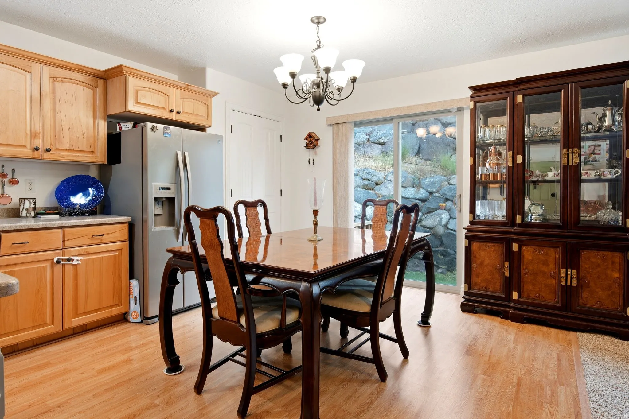 Wood-finish flooring throughout, complemented by light wood-tone cabinetry