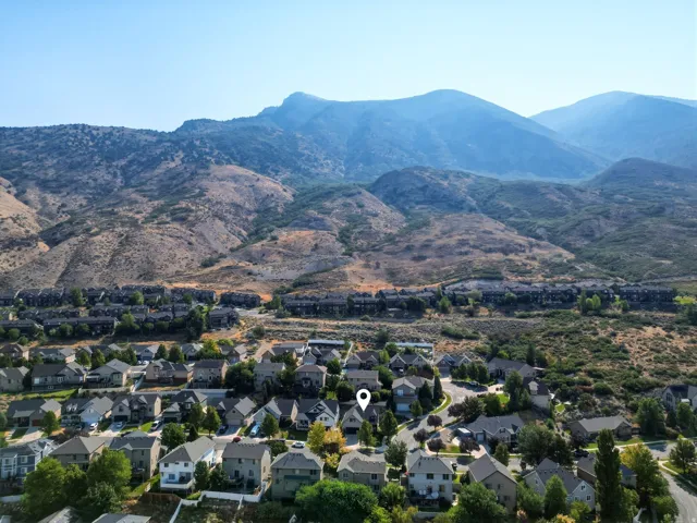 Residential neighborhood situated against a mountainous backdrop