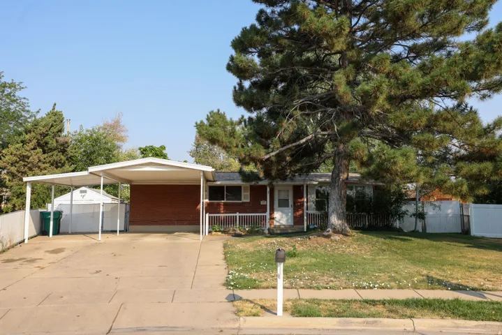 Brick exterior with 2 car carport
