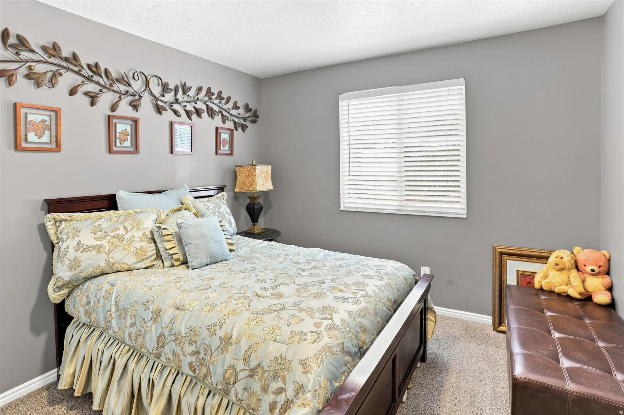 Room featuring neutral wall paint, a window with horizontal blinds, and carpeted flooring