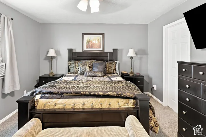 Neutral gray wall finish, white trim, and ceiling fan with lighting