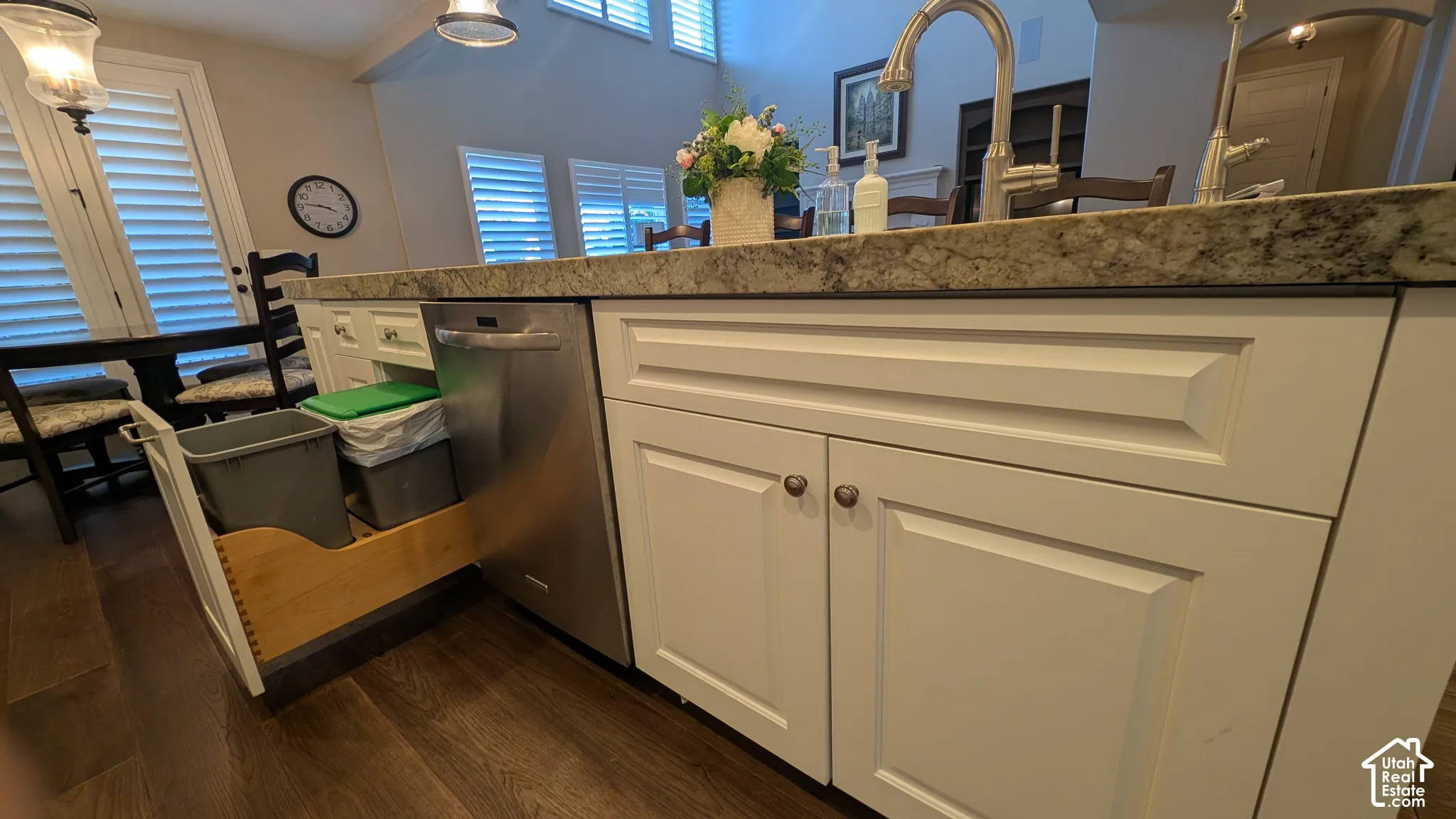 White shaker-style cabinetry with dark hardware