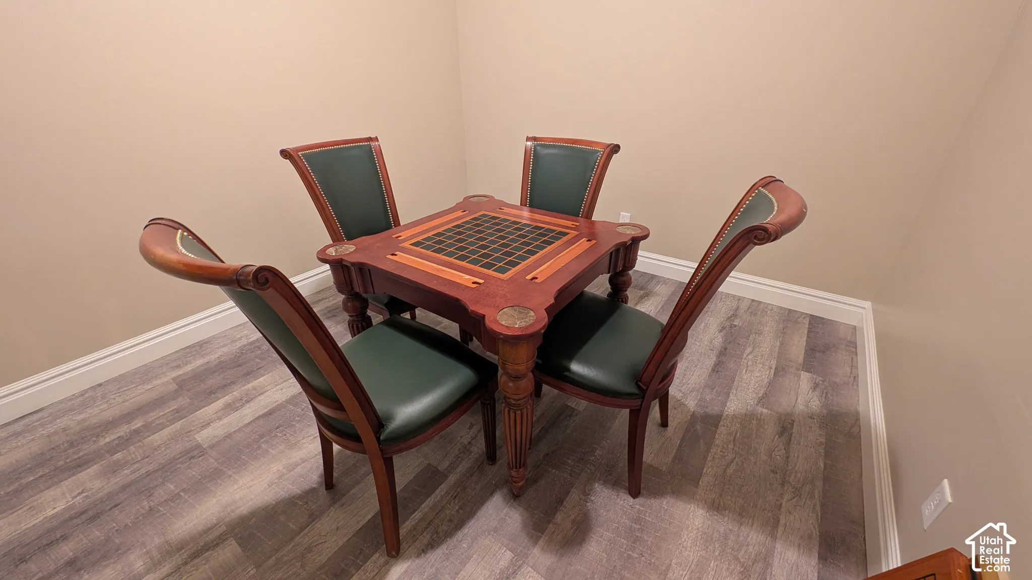 Fun game table available for purchase or included with full offer. Wood-finish flooring with light beige wall paint