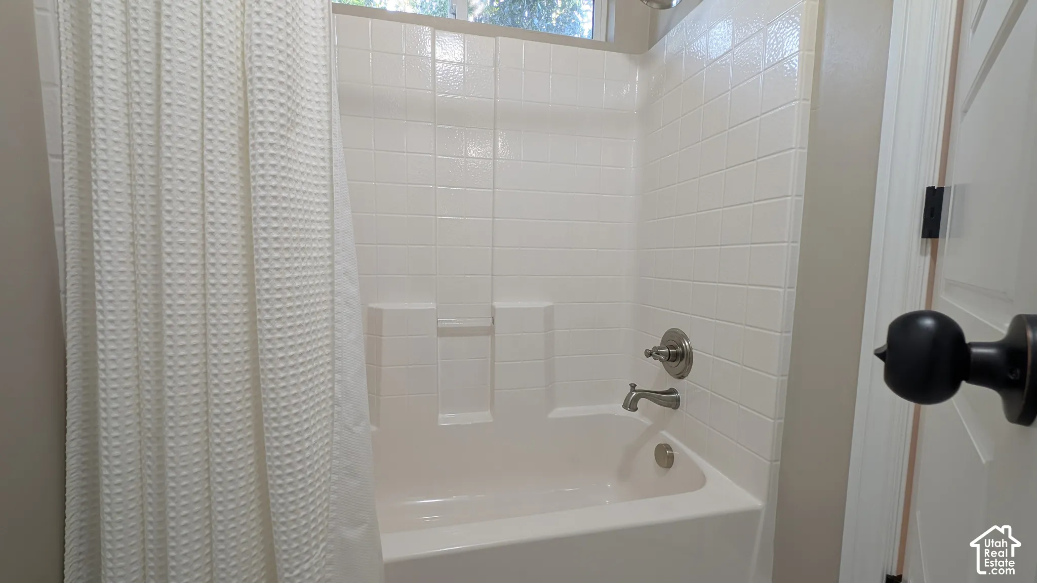 Jack and Jill Enclosed shower-tub combination with white subway tile surround and brushed nickel fixtures