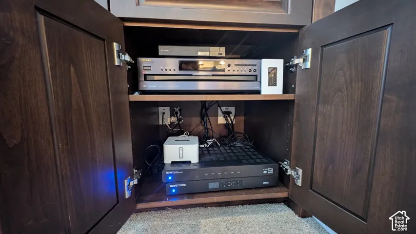 Sound system throughout home. Custom built-in cabinetry with dark wood-finish doors and concealed hinges