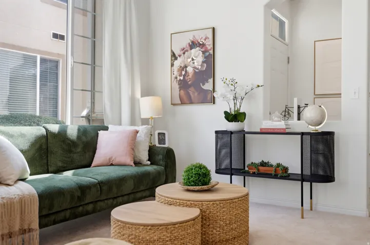 Expansive window with vertical panes, white wall finishes, and carpet flooring