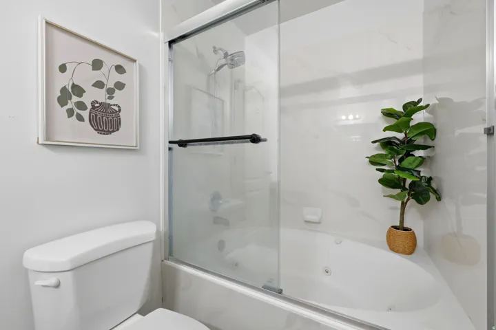 White tile surround with integrated lighting and soaking tub
