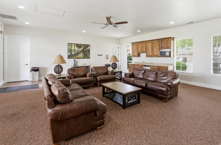 Recessed lighting, ceiling fan, and carpeted flooring
