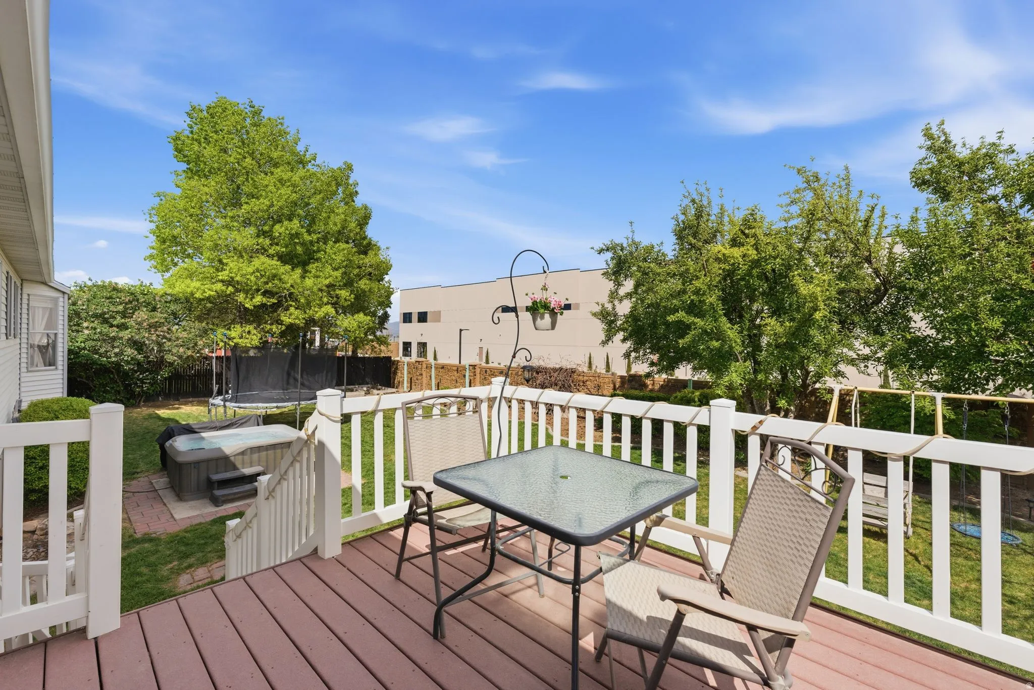 Spacious wood-finish deck with white railings