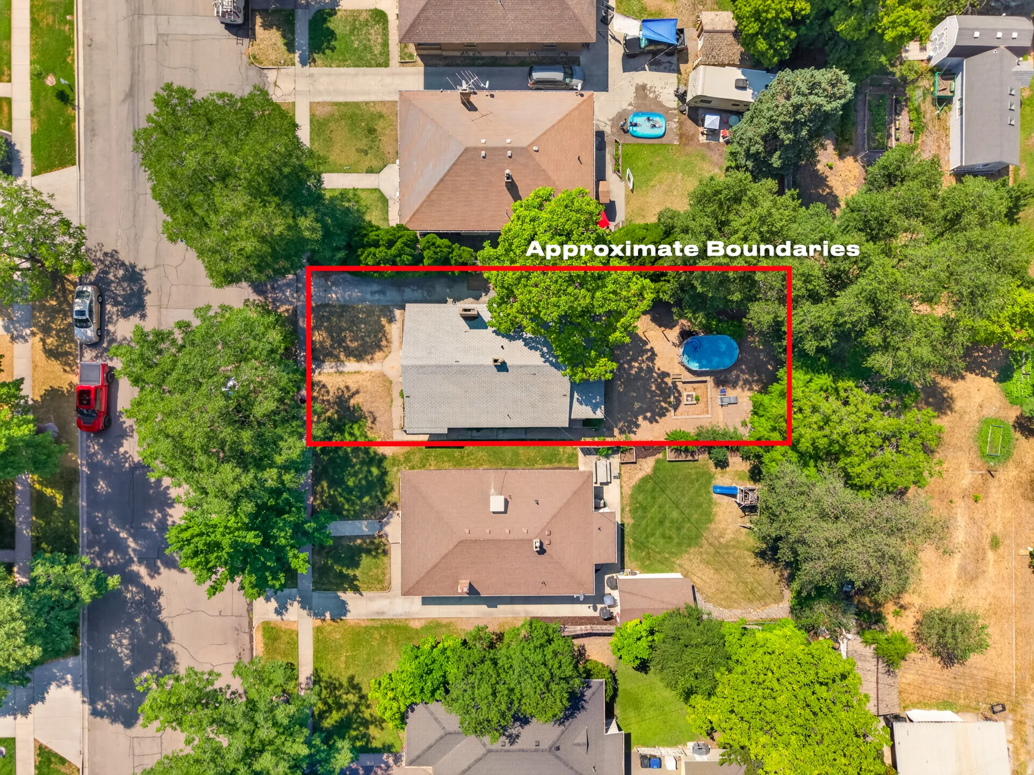 Aerial view showcasing the property in red
