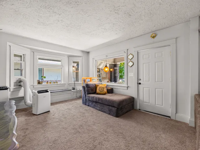 Open living room with lush carpet