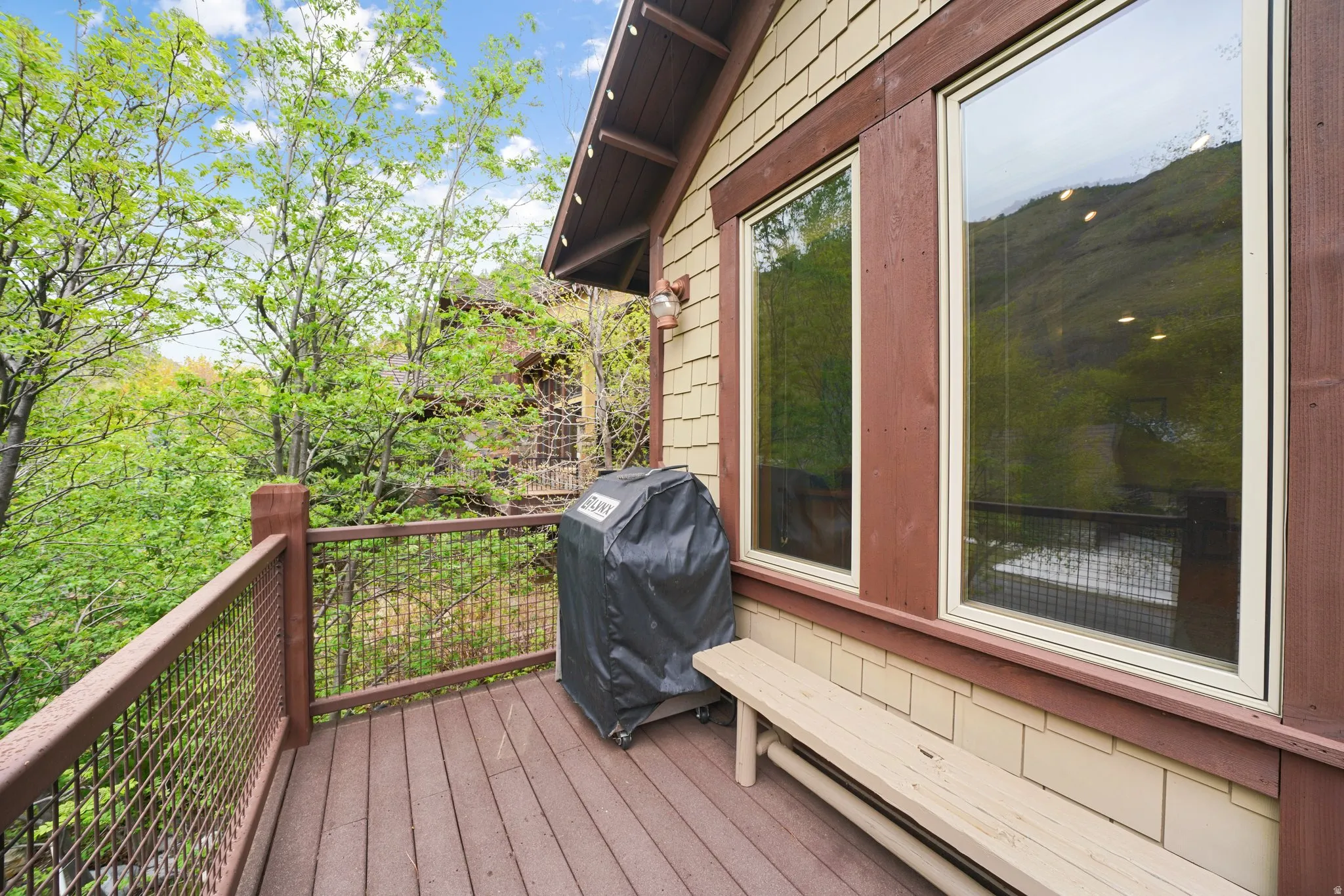 Expansive deck with composite decking and metal railing