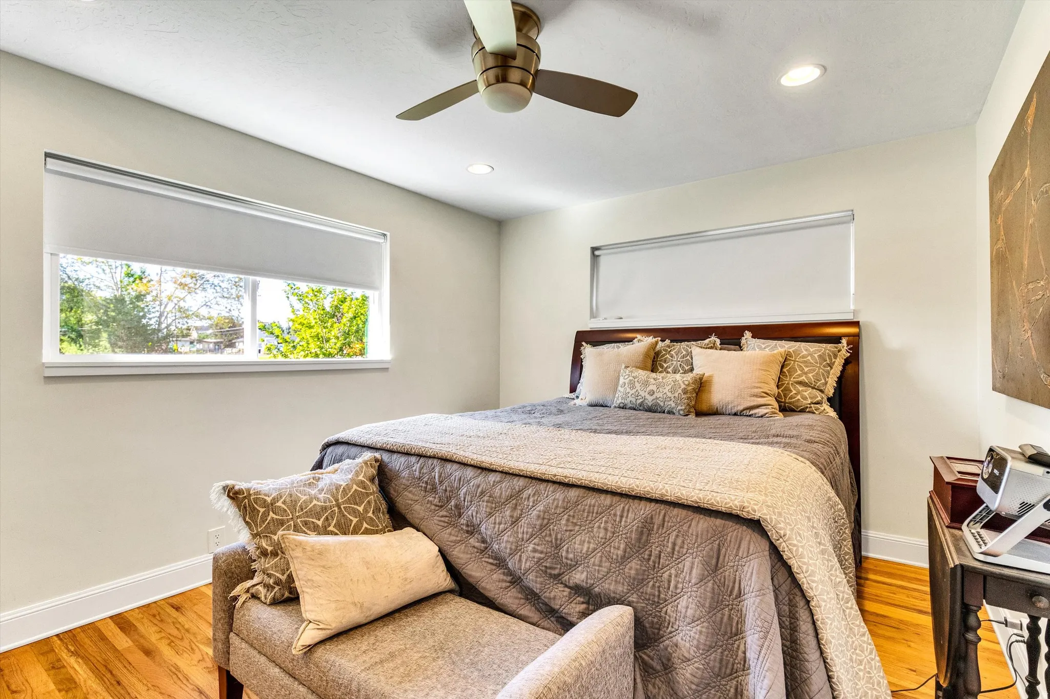 Bright interior space featuring light-toned walls, recessed lighting, and a ceiling fan