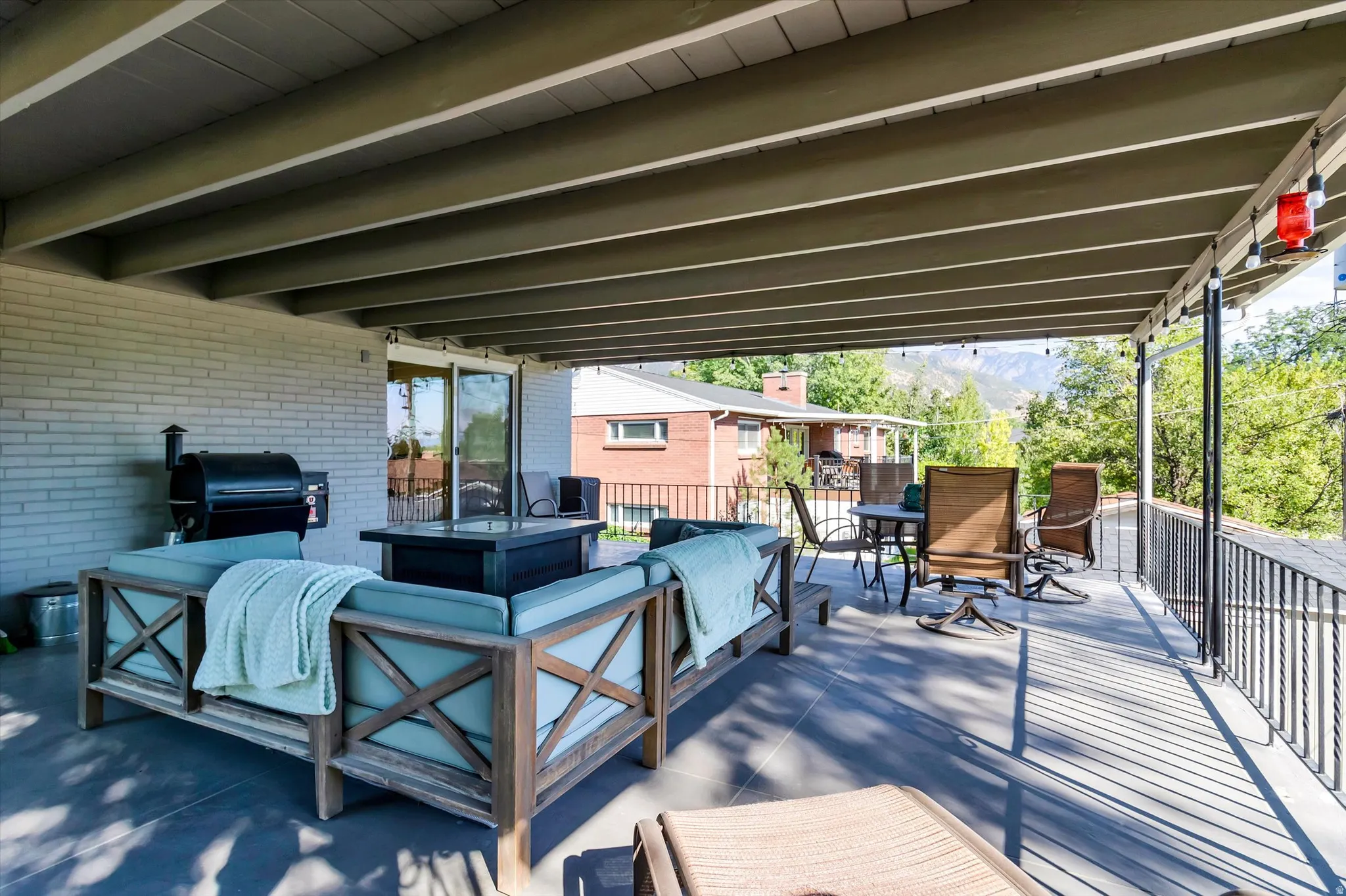Spacious covered patio featuring , concrete sealant gives appearance of tile flooring, sliding glass door provides access,