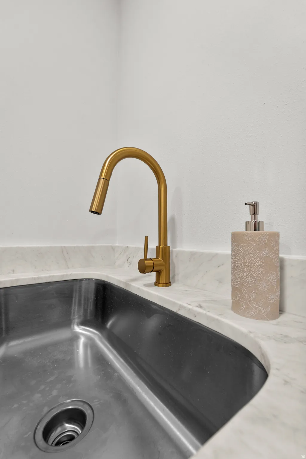 Undermount stainless steel sink with a gooseneck faucet