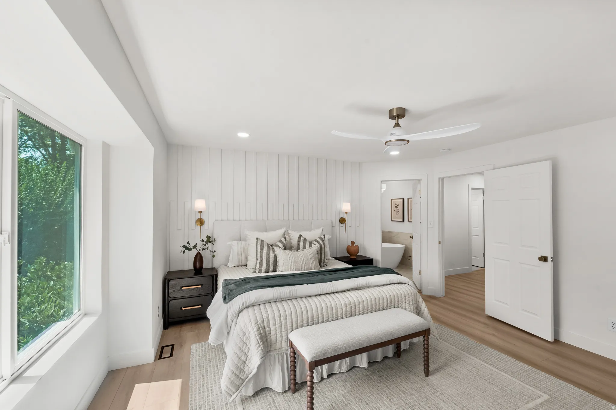 Recessed lighting, wood-finish flooring, and a modern ceiling fan