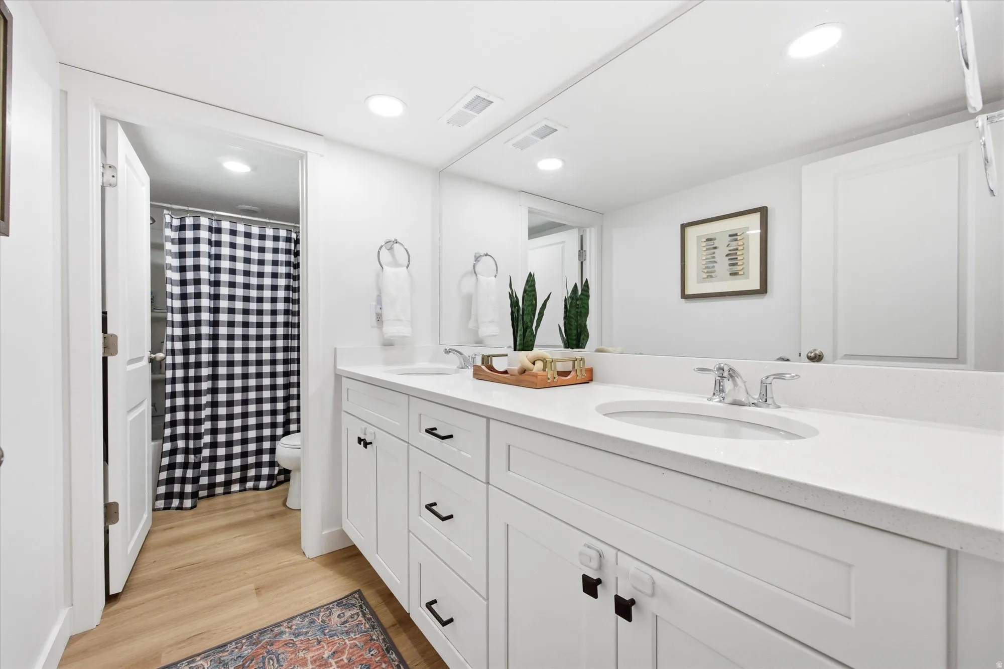 Dual vanity with integrated sinks and chrome fixtures