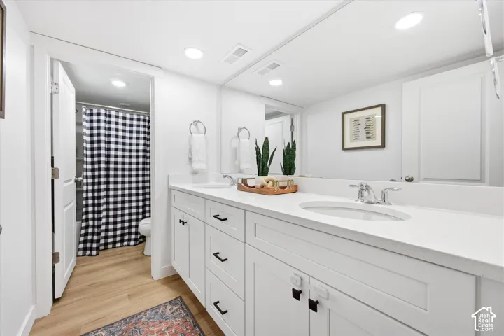 Dual vanity with integrated sinks and chrome fixtures