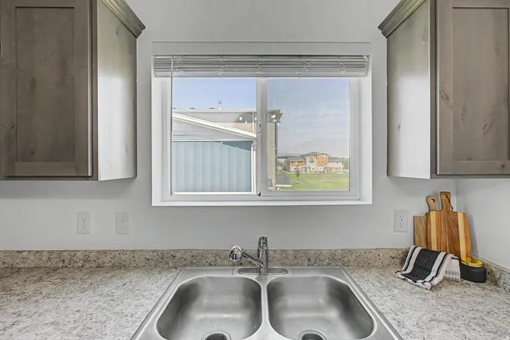Double basin stainless steel sink with a chrome faucet