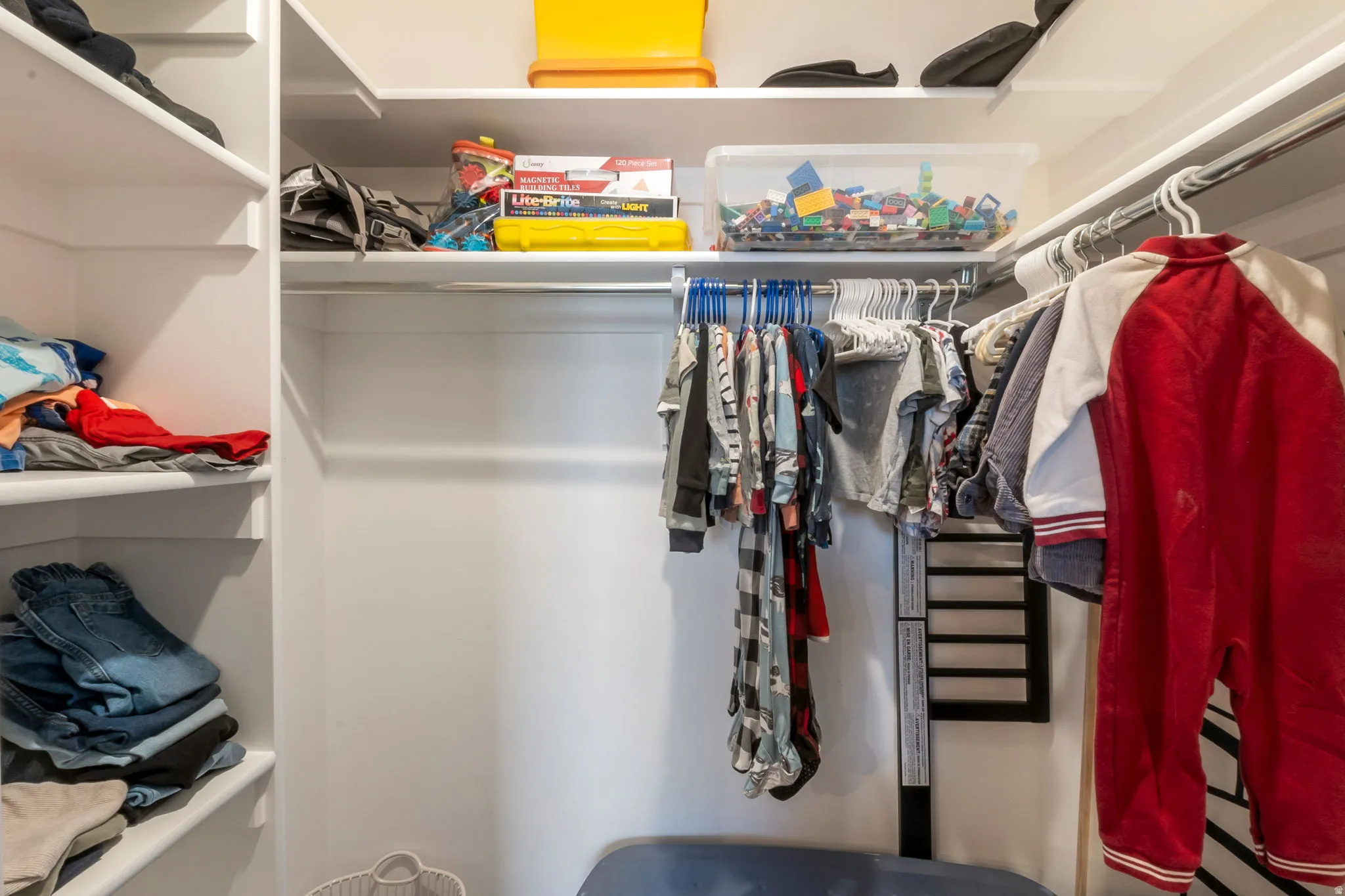 White built-in shelving system featuring multiple storage levels