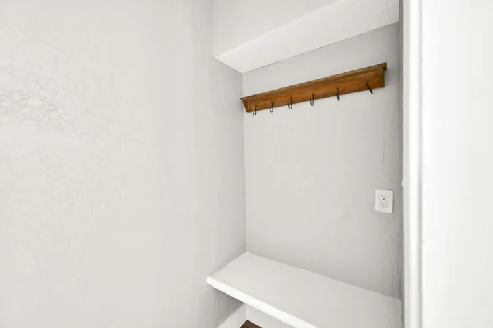 Built-in bench with a wooden coat rack