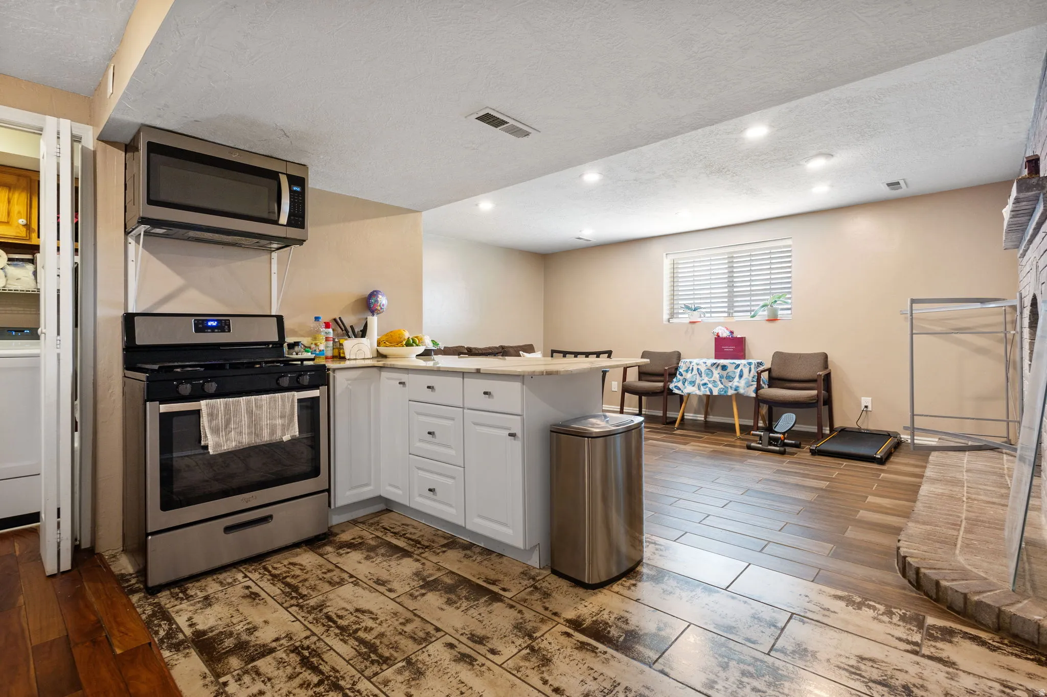 Stainless steel range with an overhead microwave