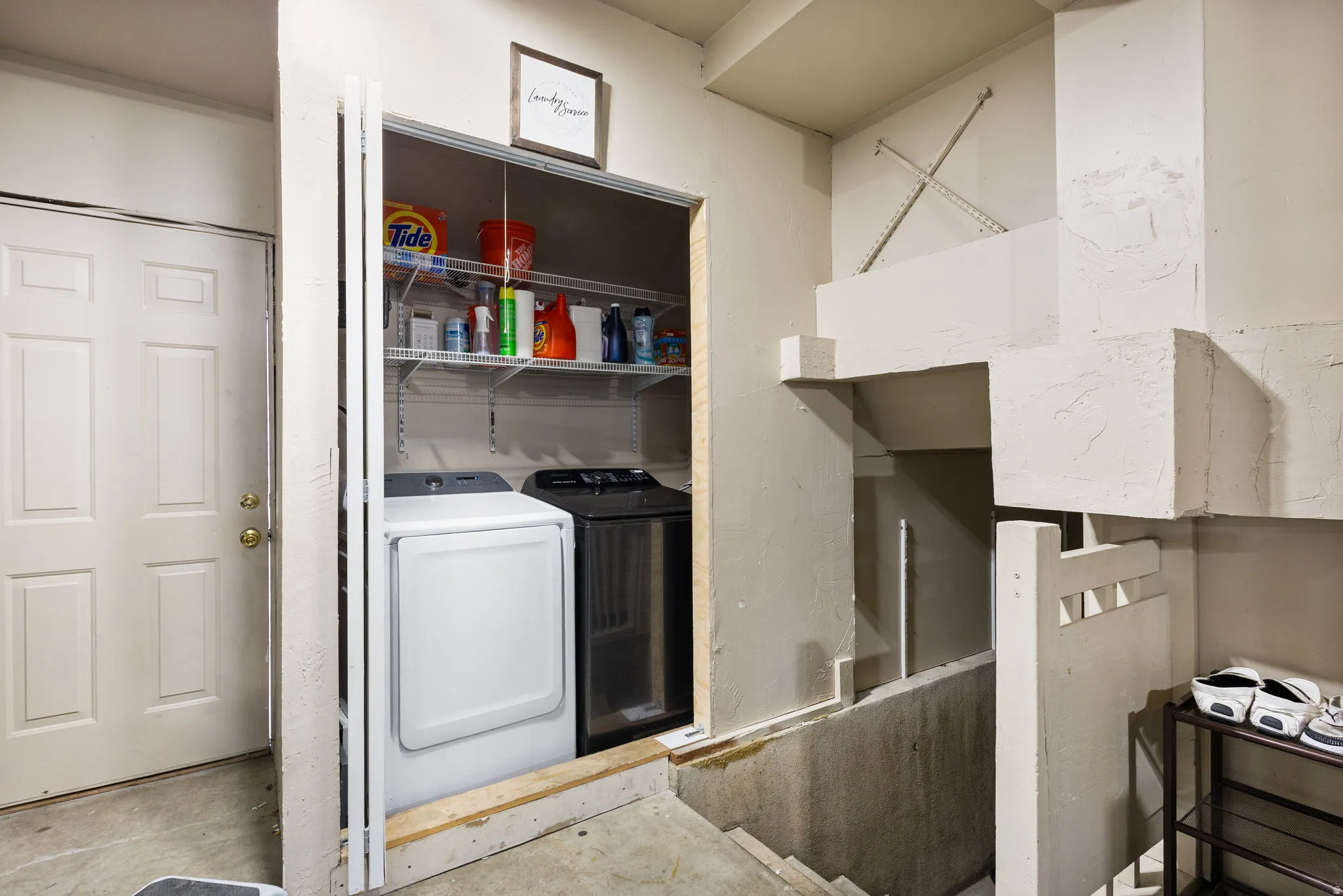 Built-in laundry closet with adjustable wire shelving