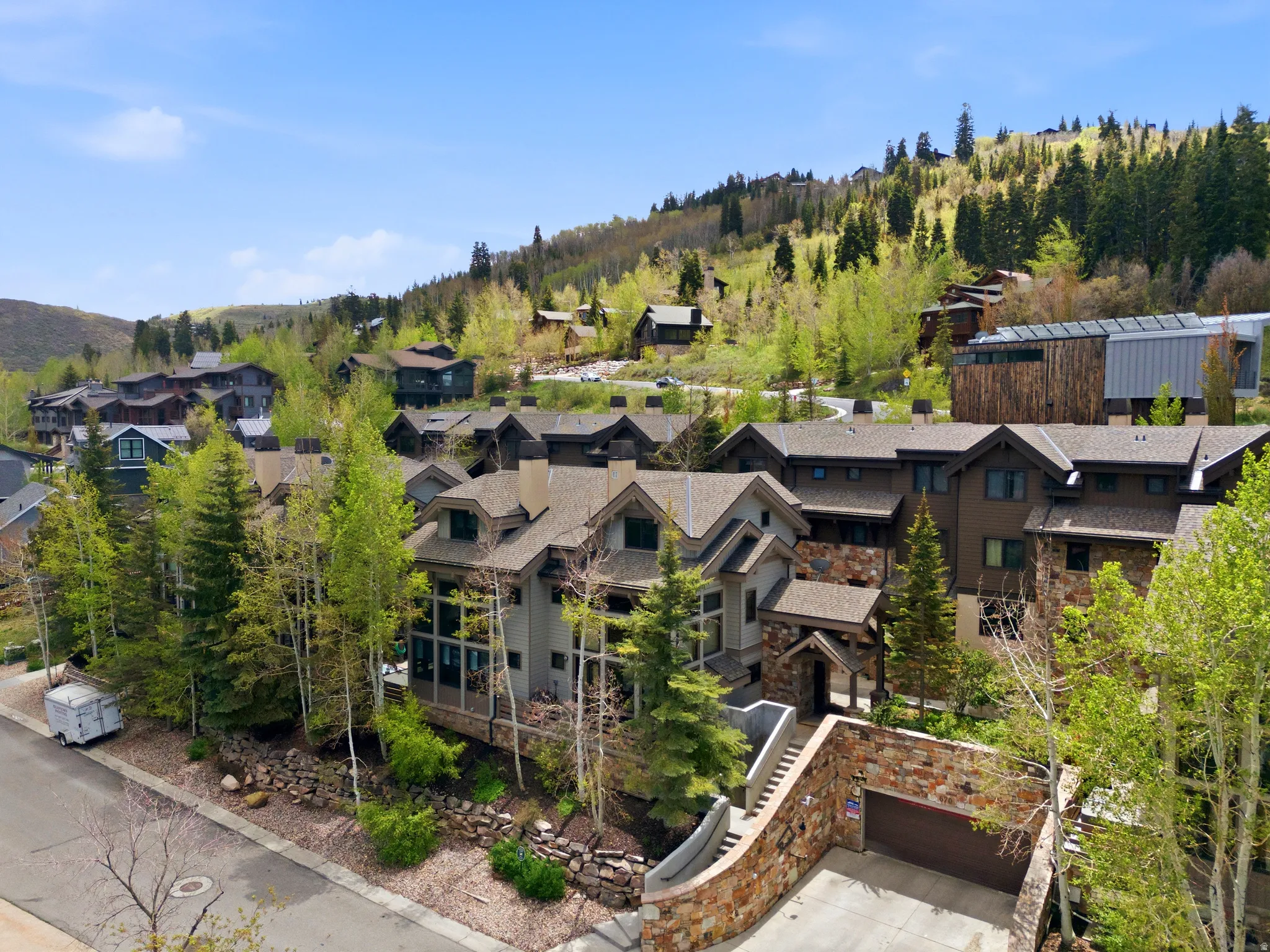 Luxury mountain resort-style community nestled among mature evergreen and aspen trees