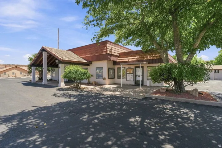 Paved lot with established trees and landscaping