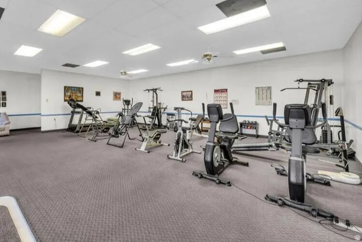Carpeted flooring, recessed lighting, and ceiling fans