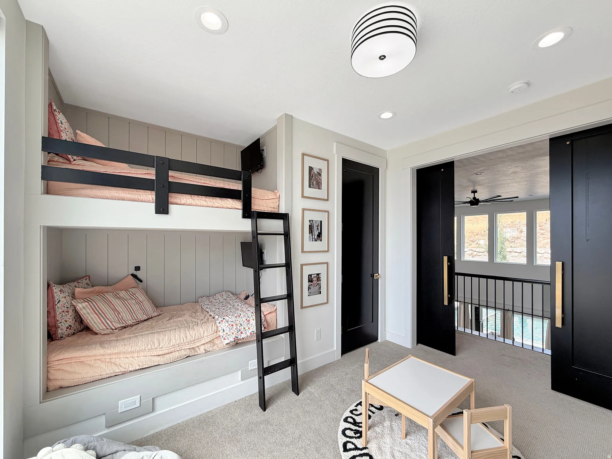 Built-in bunk beds with integrated ladder and recessed lighting