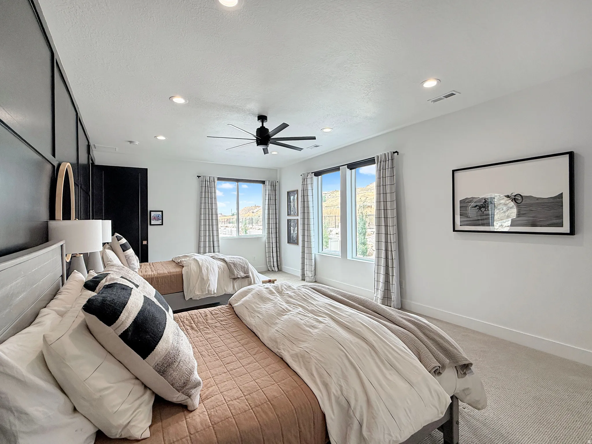 Recessed lighting, ceiling fan, and carpeted flooring