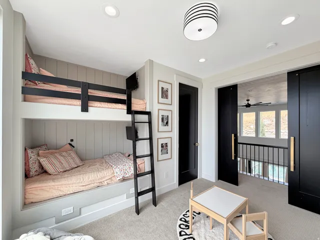 Built-in bunk beds with integrated ladder and recessed lighting