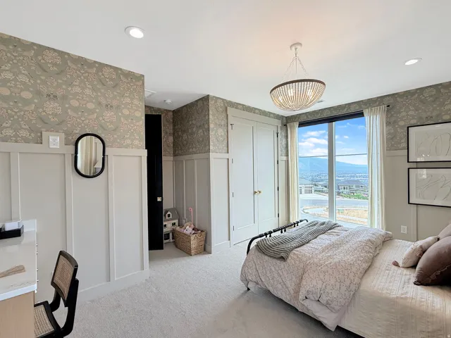 Board and batten wall paneling with decorative wallpaper, recessed lighting, and a drum pendant light fixture