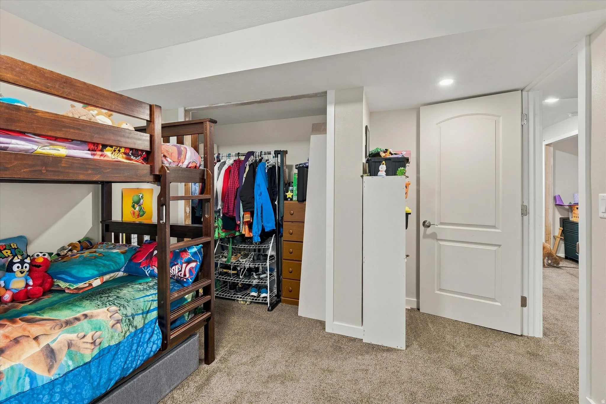 Recessed lighting, light gray carpet, and white paneled doors