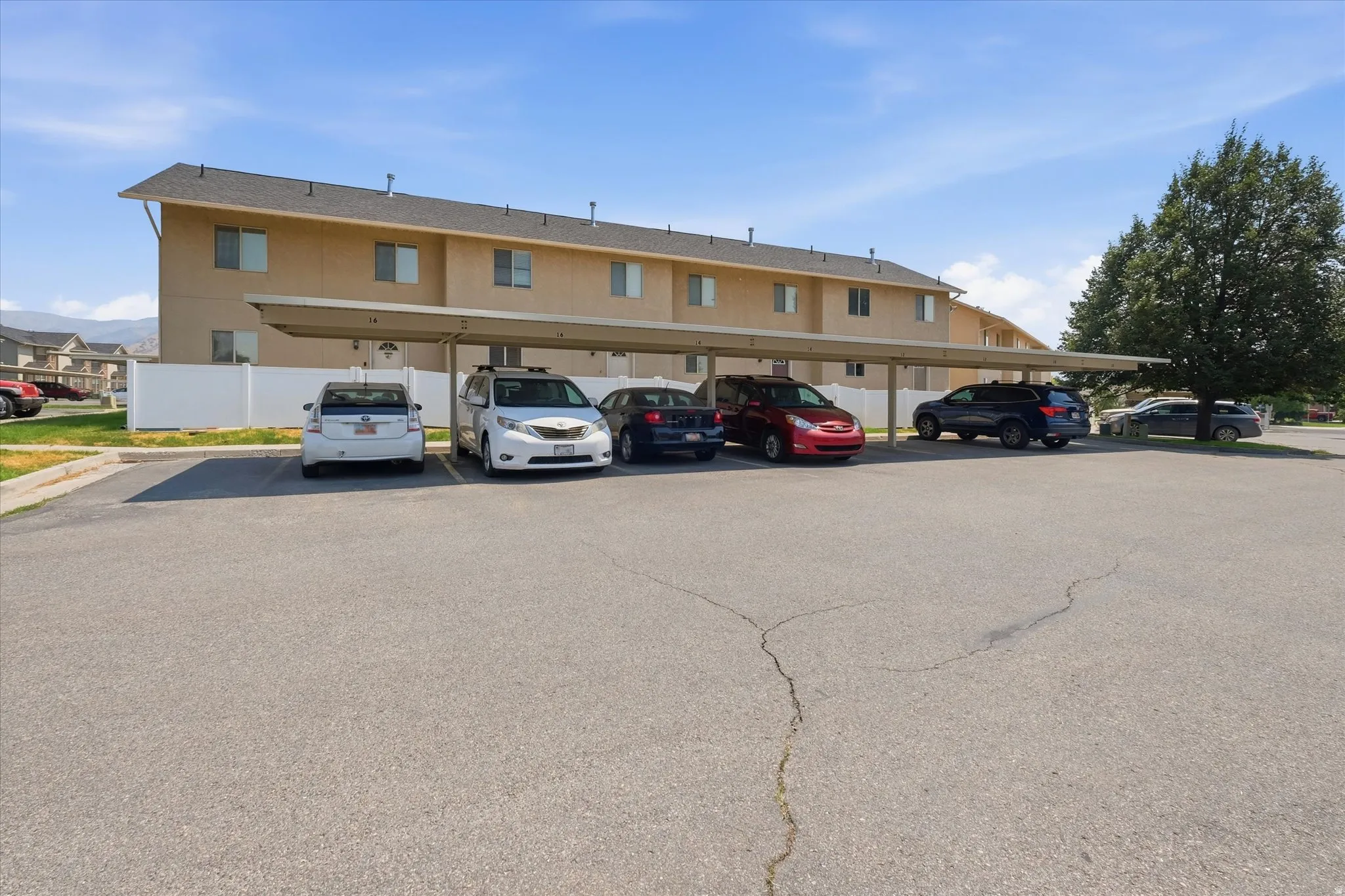 Covered parking structure with multiple spaces