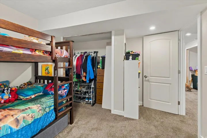 Recessed lighting, light gray carpet, and white paneled doors