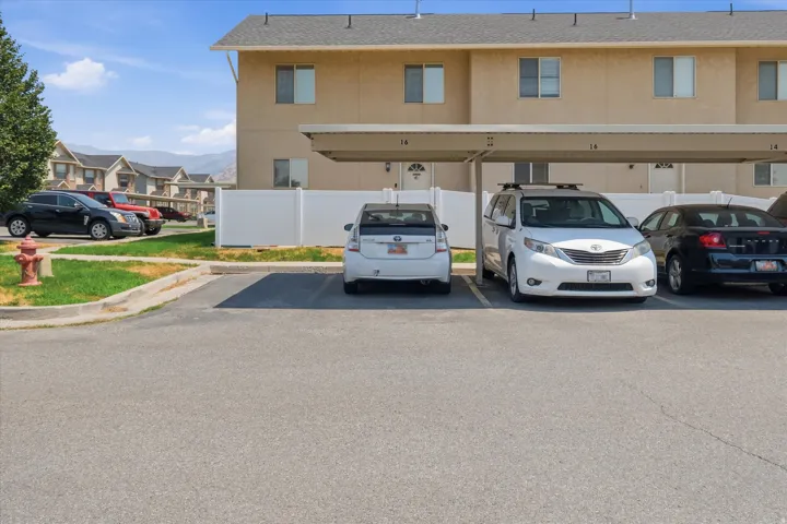 Covered parking structure with individual unit entrances