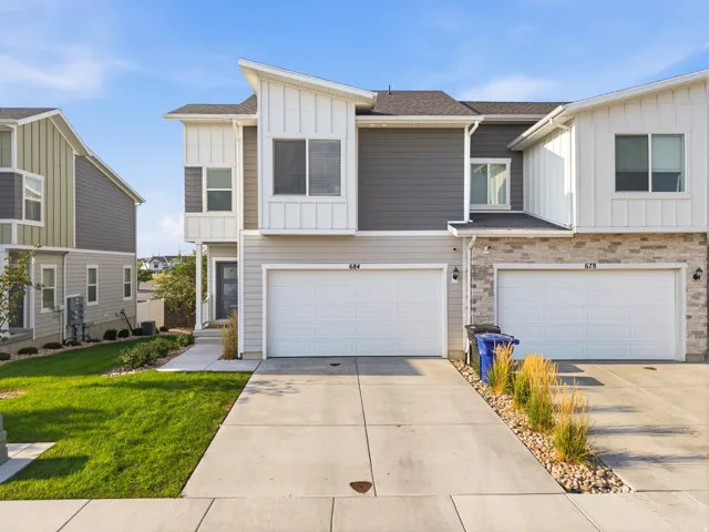 Modern façade featuring vertical white siding and horizontal gray siding