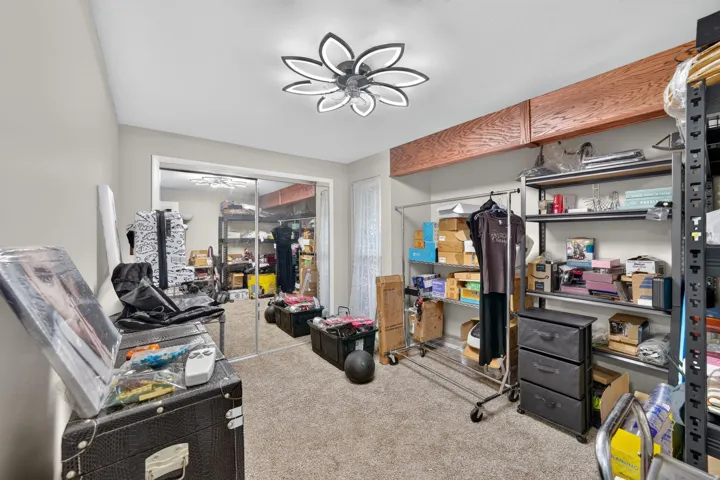 Mirrored closet doors, recessed storage above, and a modern ceiling light fixture