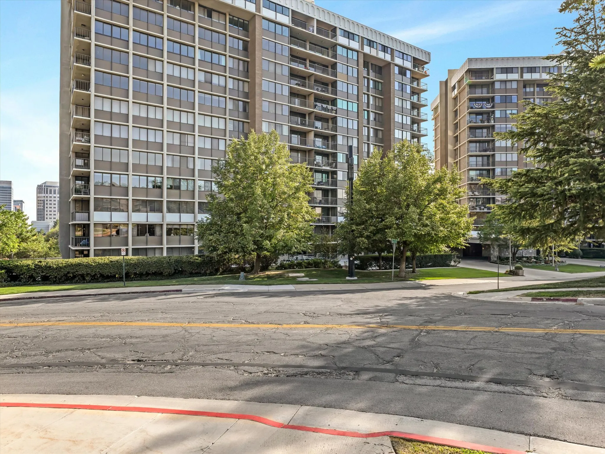 Building exterior featuring multi-story construction, numerous windows, and multiple balconies