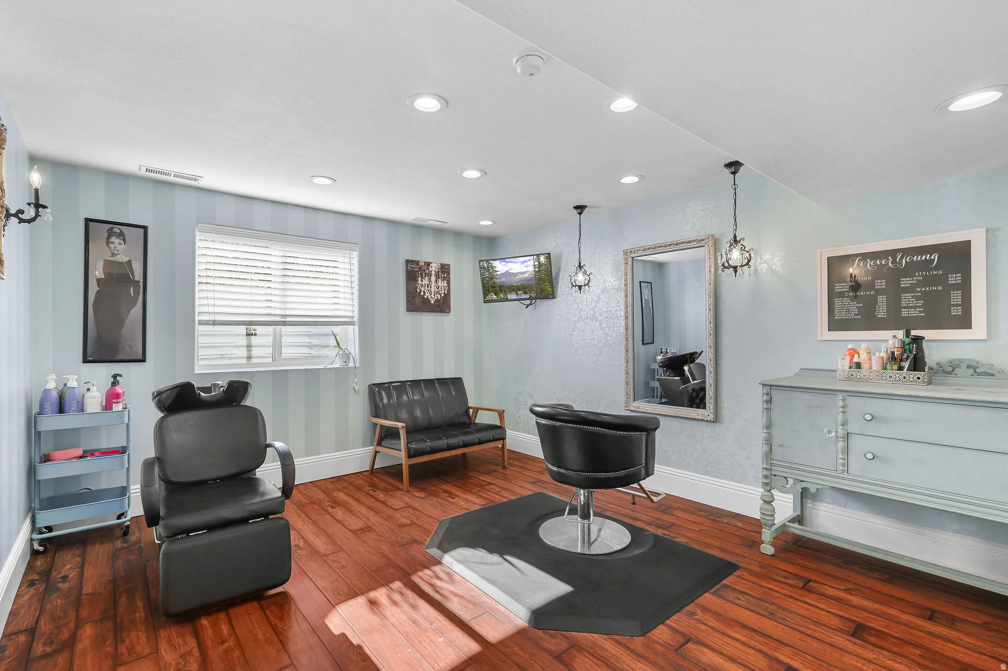 Wood-finish flooring, recessed lighting, and a built-in window with blinds