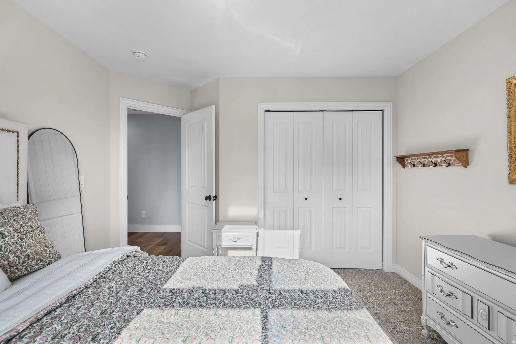 Recessed ceiling lighting, bi-fold closet doors, white paneled interior doors, and neutral wall paint