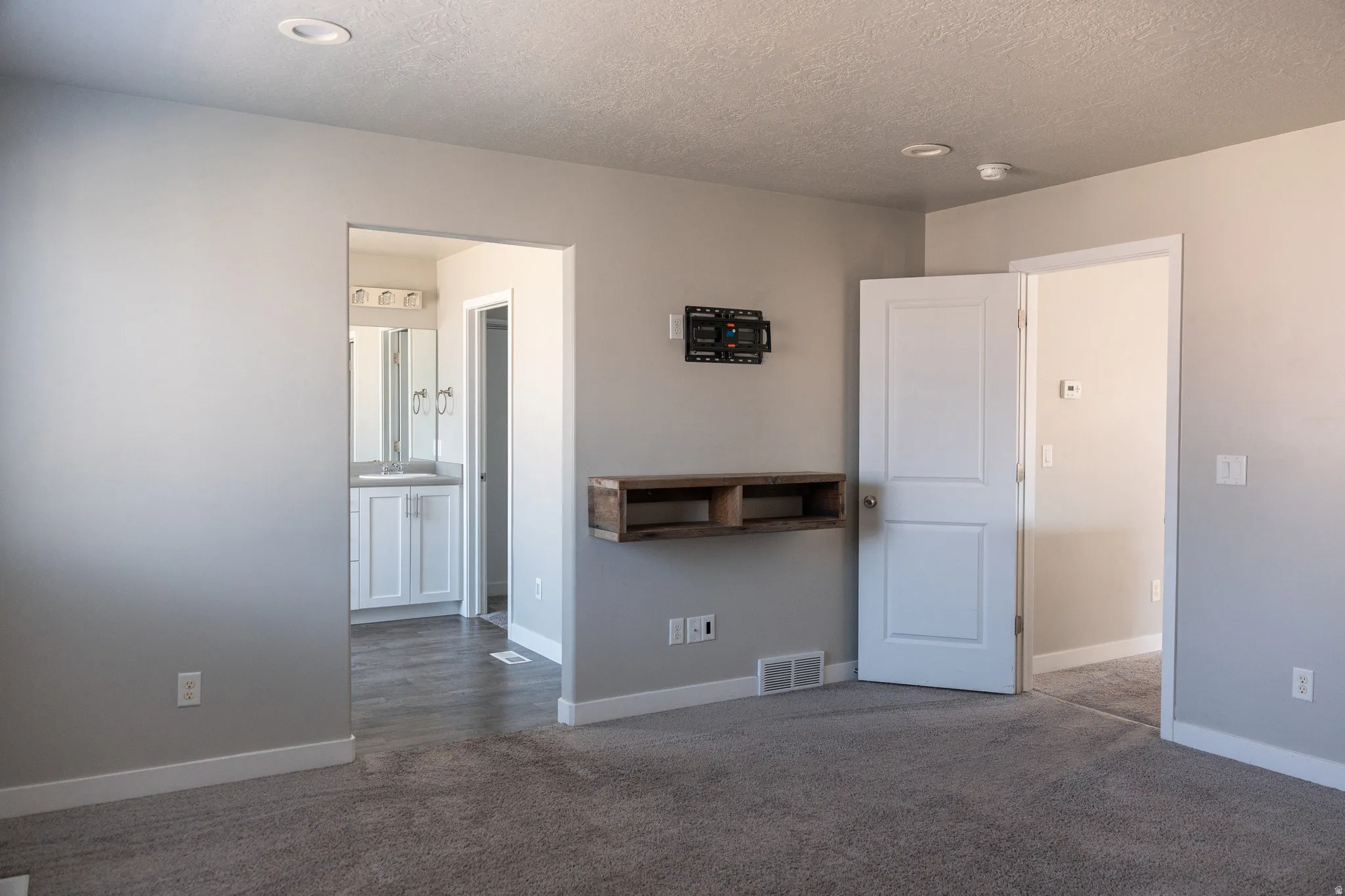 Plush carpeting with light gray wall paint
