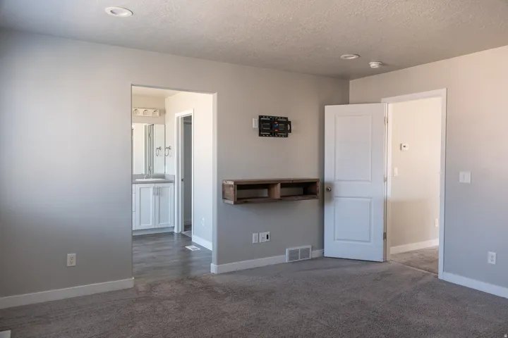 Plush carpeting with light gray wall paint