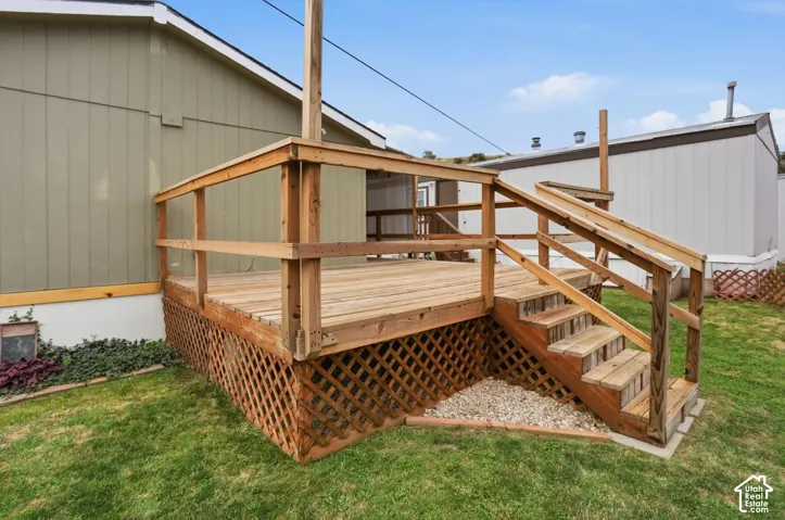 Wooden deck with integrated stairs and latticework skirting