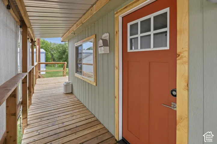 Expansive wooden deck with a corrugated metal overhang